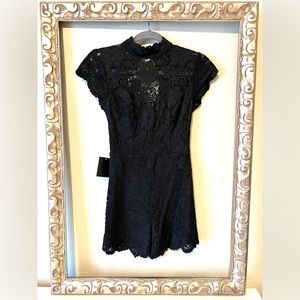 BEBE black lace romper— open back, high neck with sweetheart underlay.